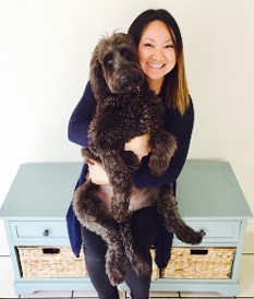 woman holding labradoodle